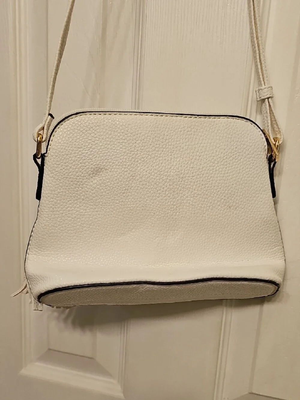 Two-Tone White and Black Crossbody Bag with Tassel Accent